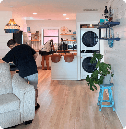 Professional cleaners working in a home
